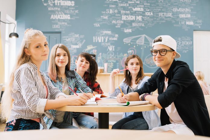group students posing table