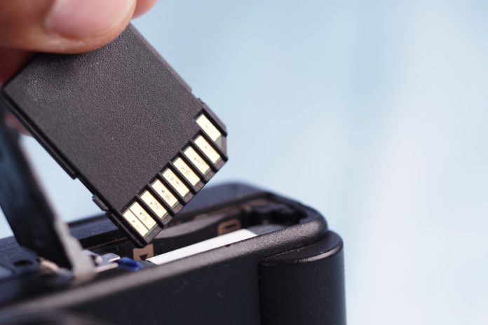 Removing a memory card from a digital camera for data transfer