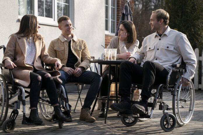 full shot happy friends chatting outside full shot happy friends chatting outside