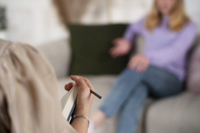 sided view young girl talking therapist sided view young girl talking therapist